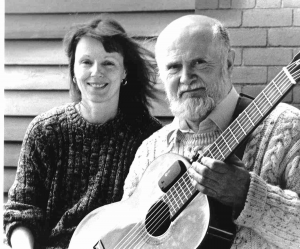 Photo of Mike and Joan in Cardiff with a guitar