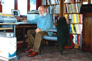 Image of Michael Raven at his desk, Ashley